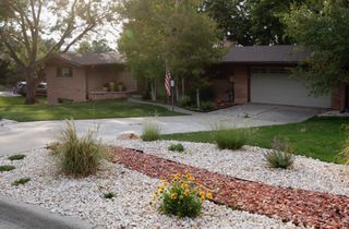 Summer View of Front Landscape - Photo provided by Seller