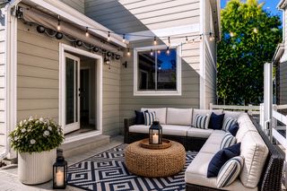 Virtually staged patio with retractable awning and expandable privacy fence