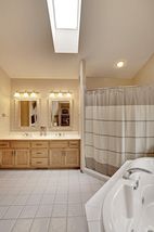 Double Vanity, Large Shower, Vaulted Ceiling and Skylight!