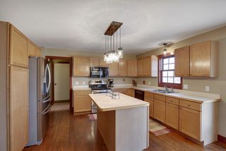 Updated appliances, new light fixtures, and custom shaker style cabinets