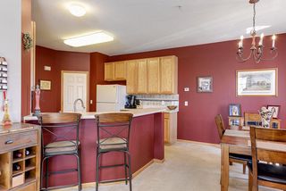 Bar and kitchen area with raised countertops
