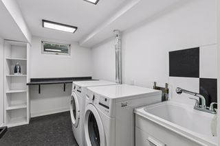A finished laundry room rounds out the impressive lower level with new washer & dryer and laundry sink