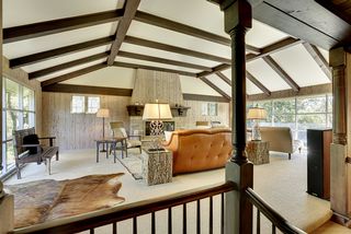 Large wood-burning fireplace creates an ambiance of comfort