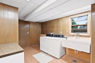 A bright Laundry Room boasting a Mud Room with a double closet, window views, easy access to the Garage, and 
a "storage area for possible 2nd Bath"!