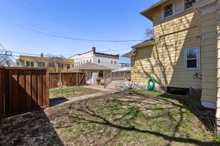 Expansive side and back yards fully fenced with paver patio and back deck