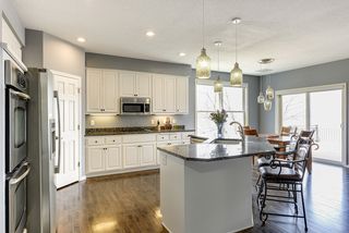 Bright kitchen with walk-in pantry, center island, and lake views!