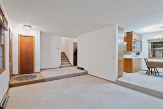 The Main Level Living Room flows to the Dining Room, Kitchen and the stairways to the Upper 2nd Level and Lower 3rd Level of the home.