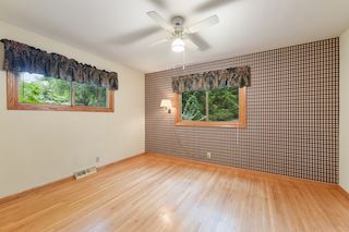 Second Bedroom looks out onto the wooded back yard.