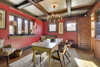 Period details abound in the Formal Dining Room! Stained Glass Windows and Box Beamed Ceilings! 