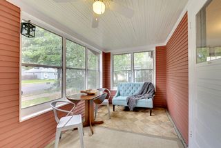 Lovely sunroom in front of the home - light-filled and airy!