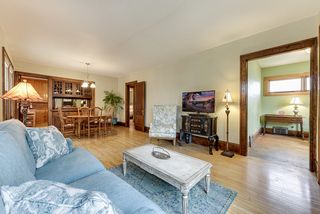 View from living room into sun room on right, dining room on left with far left door into kitchen.
