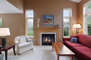 Gas fireplace with beautiful mantle.