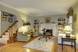 The Gracious Living Room features a Fireplace & Built-In Book Shelves...