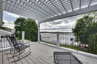 DSun screened deck area off the Owner's suite; south facing Bald Eagle Lake views.