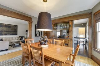 dining room with marble built-in bar and Edison Lamp sconces
