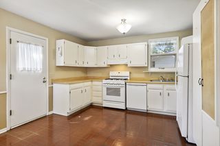 Kitchen has  back door to the  Two Car Garage, Patio and Backyard