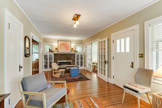 Brick Fireplace anchors entrances to Sunroom and Dining Room