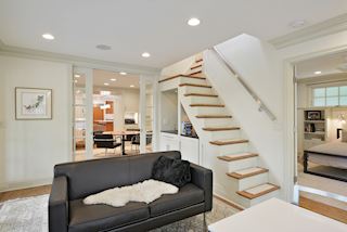 Staircase leads to private lofted space above the Master Suite