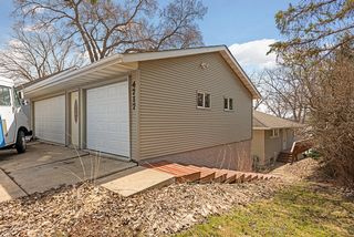 Large 3 car garage with spancrete floor with open storage below