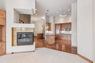 Fireplace and how open to see into the kitchen.