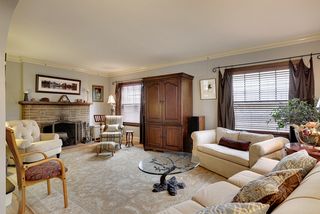 The Living Room features a Wood Burning Fireplace with Original Hand-Made Tile insets....