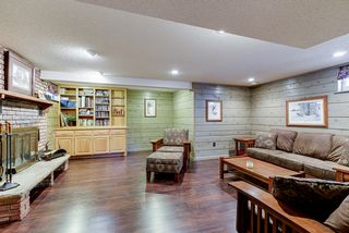 Spacious family room with new flooring and wood burning fireplace.