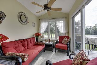 Sunroom looking out on deck and golf course 