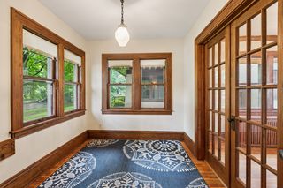 Nice Front Sunroom with Fir Flooring and French Doors!