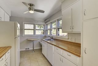 The "Galley Style" Kitchen offers a Built-In Breakfast Nook overlooking the Back Yard! 