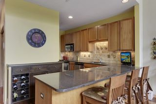 Informal bar seating adjoining kitchen. 