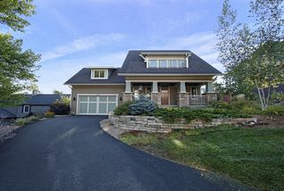 Strong, craftsmen lines, Hardi plank exterior, Marvin clad windows and stone column bases provide a warm, inviting entry.