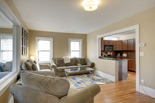 The Light-Filled Living Room features Hardwood Floors...