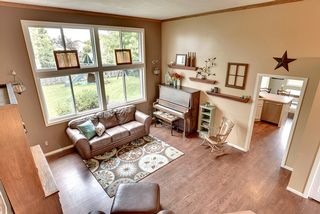Upper hallway views of this lovely gathering room. 