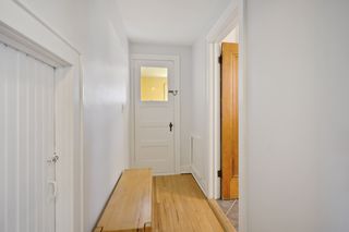 Hallway leads to second stairway that leads to another exit door and is used for storage alternatives as well