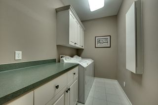 Laundry area with additional storage off the entrance to the owners suite.