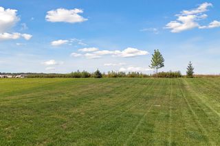 A flat, level backyard is quite nice for playing outdoors.  
Come and see for yourself why this home is better than new!