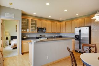 Open kitchen with recessed lighting.