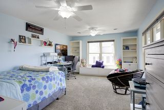 Enormous junior suite with built-in window seat and bookshelves, custom closet, and fully updated 3/4 bath
