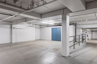 Two Parking spots - Blue doors are entrance to storage area for this home only.