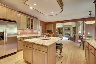 This professionally designed kitchen has an abundance of cabinet space throughout.