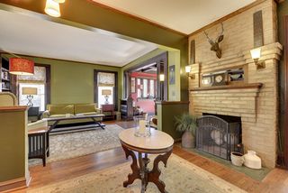 The Grand Entry Foyer features a Wood Burning Fireplace! 