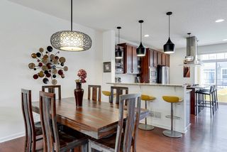 Laminate wood flooring extends to the dining room - there is space for a large table.