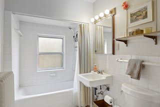 Second floor full  bath that completes the possible rental unit