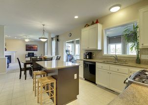 Spacious open kitchen flow right into family room and four season porch