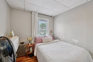 View of Bedroom in Apt #3,
Features Hardwood floors and new thermal pane windows.
NOTE: Tenant had temporary wallpaper that was removed-Will be painted.