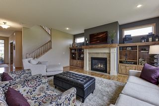Living room with builtins and fireplace