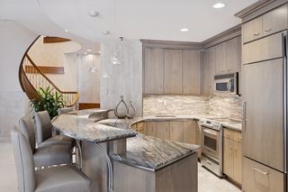 Beautifully designed two-level bar with a complete working kitchen.