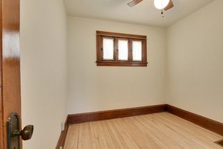Bedroom #1 features Original Piano Windows and Hardwood Floors! 