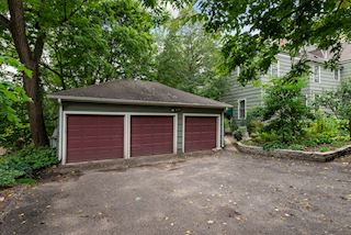 Three car garage is accesed through driveway entry from Clarence Ave SE
