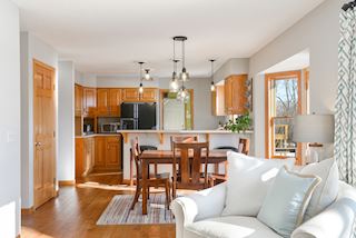 Great room flows into the kitchen with updated lighting